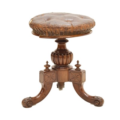 Lot 531 - Stamped Victorian stained walnut revolving piano stool