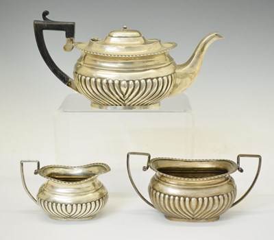 Lot 243 - Late Victorian silver three-piece tea set with gadroon decoration