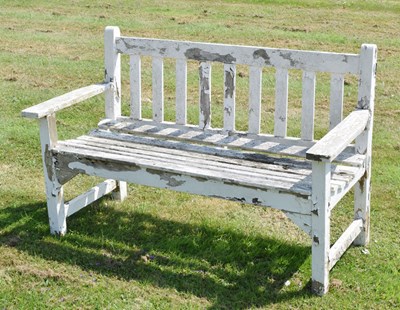 Lot 5 - White painted teak garden bench of slatted design, 128cm wide