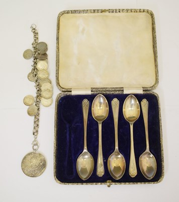 Lot 226 - Set of five silver 'Golfing' spoons, and a silver charm bracelet