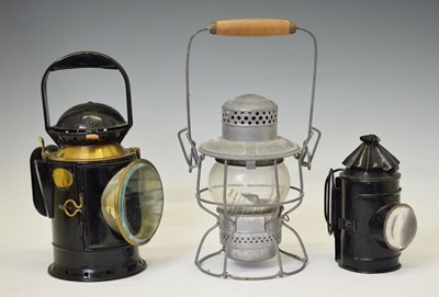 Lot 320 - Three hand lamps or lanterns