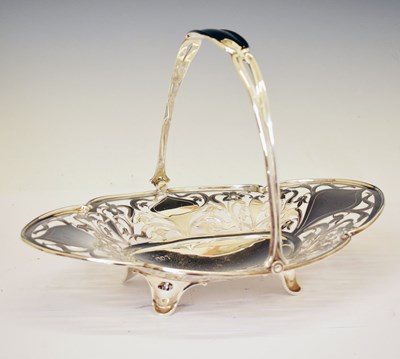 Lot 237 - Edward VII silver basket with pierced floral decoration and swing handle