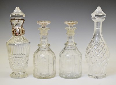 Lot 402 - Two Waterford crystal decanters, four Elizabeth II silver decanter labels, etc