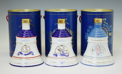 Lot 347 - Three Bell's Scotch Whisky commemorative decanters by Wade, and one 50cl decanter