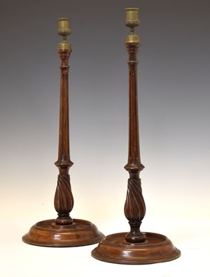 Lot 221 - Pair of George III style carved and turned mahogany candlesticks