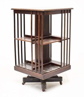 Lot 589 - Mahogany revolving bookcase quadripartite