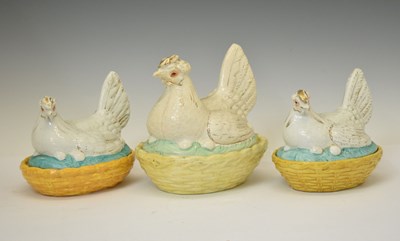 Lot 411 - Three  pottery hens on nest