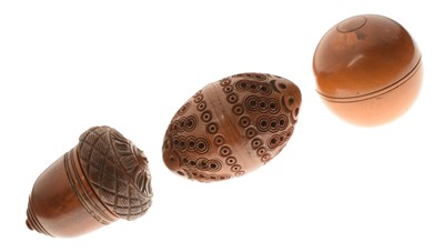 Lot 283 - Treen acorn-form nutmeg grater, plus a coquilla nut, and a treen spherical box (3)