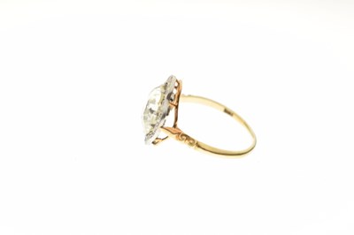 Lot 4 - Early 20th century diamond 18ct yellow gold and platinum set halo ring