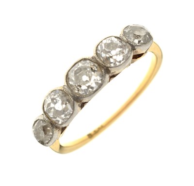 Lot 7 - Early 20th century diamond 18ct yellow gold and white metal set five stone ring