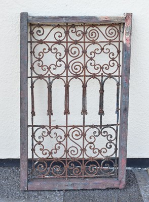 Lot 65 - Moroccan wrought iron and wood framed Riad window grille