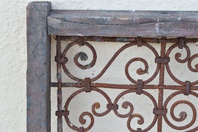 Lot 65 - Moroccan wrought iron and wood framed Riad window grille