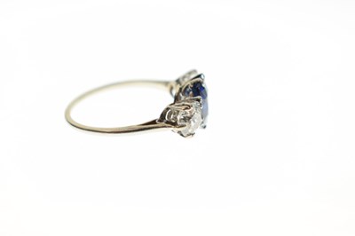 Lot 13 - Sapphire and diamond white metal three-stone ring