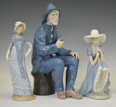 Lot 433 - Nao seated fisherman and two ladies (3)