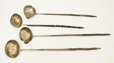 Lot 231 - Four 19th century toddy ladles with twisted baleen handles