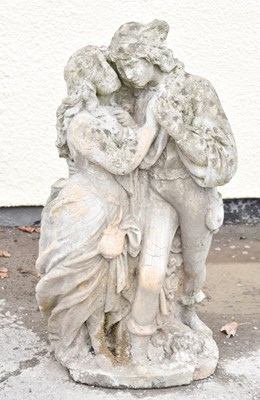 Lot 764 - Reconstituted stone garden statue of a courting couple