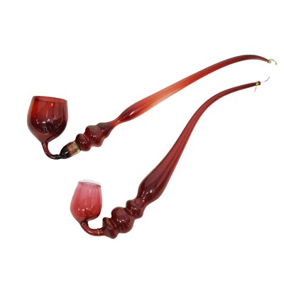 Lot 456 - Two 'Nailsea' cranberry glass pipes