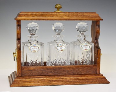 Lot 278 - Reproduction oak three-bottle tantalus