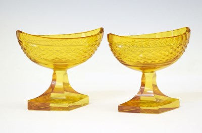 Lot 459 - Pair of late 19th century amber cut glass pedestal salts