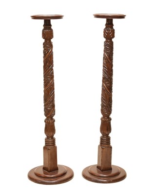 Lot 713 - Pair of early 20th century carved mahogany torchères