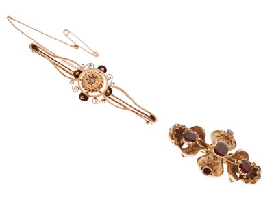 Lot 125 - '15ct' yellow metal and diamond bar brooch and a Victorian style garnet brooch