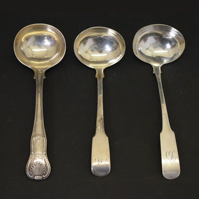 Lot 194 - Three George III silver sauce ladles