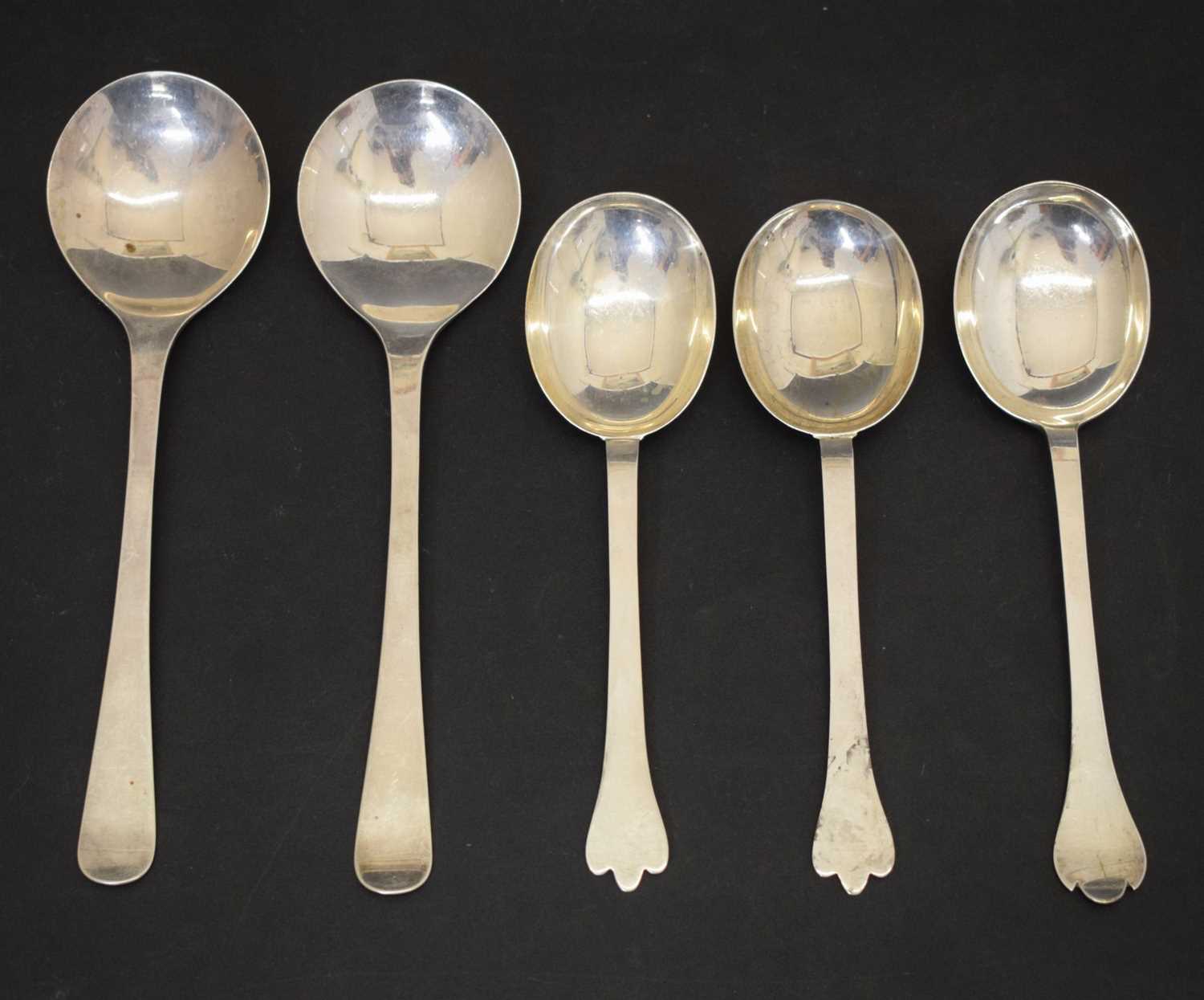 Lot 195 - Three trefid spoons and two silver serving spoons