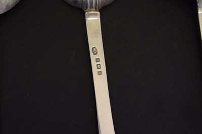 Lot 195 - Three trefid spoons and two silver serving spoons