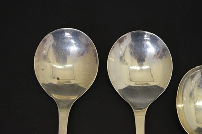 Lot 195 - Three trefid spoons and two silver serving spoons