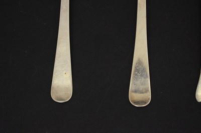 Lot 195 - Three trefid spoons and two silver serving spoons