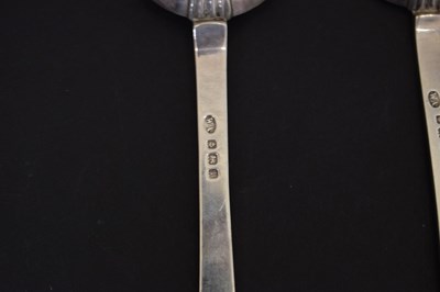 Lot 195 - Three trefid spoons and two silver serving spoons