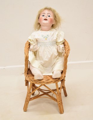 Lot 443 - Early 20th century German bisque porcelain doll and wicker doll