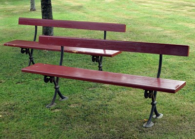 Lot 520 - Pair of early 20th century platform-style four-seater benches