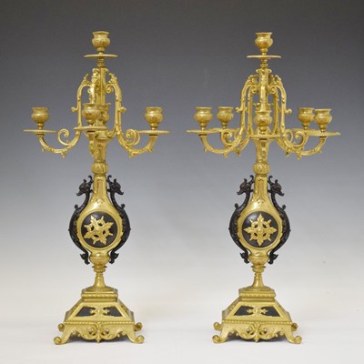 Lot 337 - Pair of French style gilt and anodised cast metal five-branch (six-light) candelabra