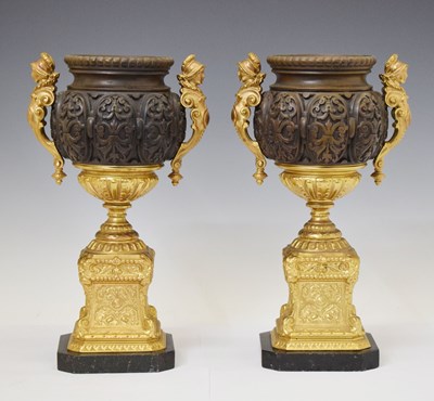 Lot 314 - Pair of French style patinated and gilt metal urns and pedestals