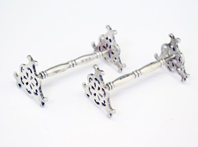 Lot 165 - Pair of George V silver knife rests