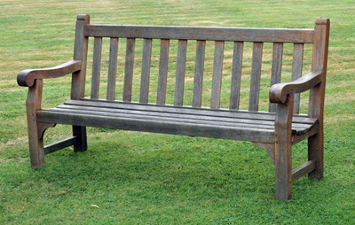 Lot 521 - R A Lister & Company of Dursley - 'Burma Teak' three seater garden bench