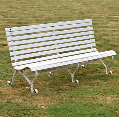 Lot 519 - White painted teak three-seater garden bench of slatted design