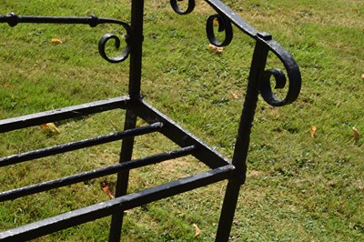Lot 514 - Black painted wrought iron garden bench