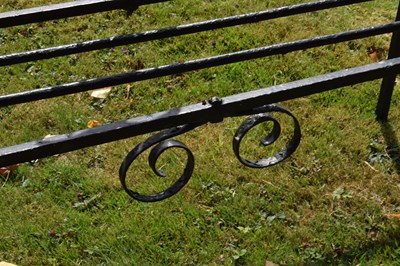 Lot 514 - Black painted wrought iron garden bench