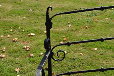 Lot 514 - Black painted wrought iron garden bench