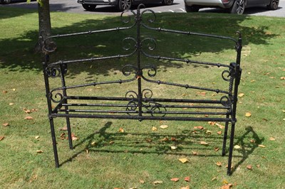 Lot 514 - Black painted wrought iron garden bench