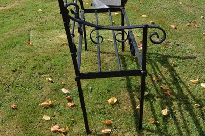 Lot 514 - Black painted wrought iron garden bench
