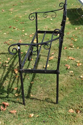 Lot 514 - Black painted wrought iron garden bench