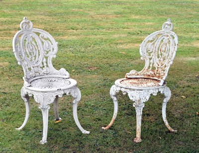 Lot 516 - Pair of late 19th / 20th century Coalbrookdale style cast iron terrace/patio chairs