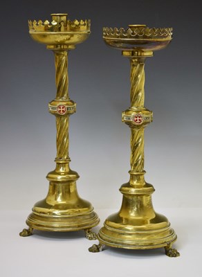 Lot Pair of mid 19th century Irish gothic revival gilt brass ecclesiastical candlesticks