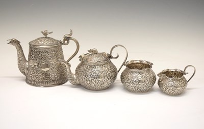 Lot 170 - Late 19th century Colonial Indian white metal matched four-piece teaset in the Kutch manner