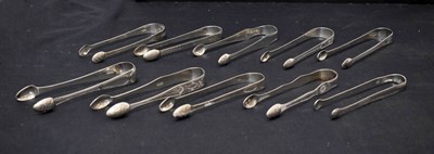 Lot 262 - Ten pairs of George III silver sugar tongs each with bright-cut decoration