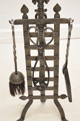 Lot 348 - Arts & Crafts-style wrought iron companion set