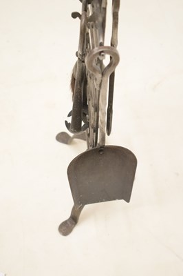 Lot 348 - Arts & Crafts-style wrought iron companion set